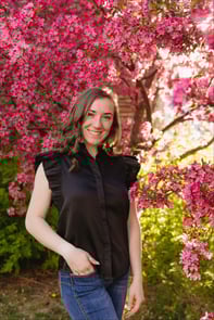 Ashlee Gibbons stands in front of a tree