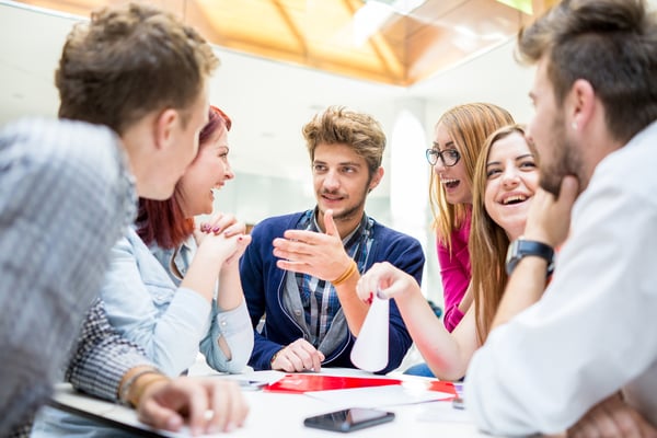 Students in conversation around a table