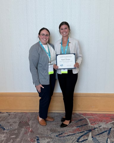 Madison Amundson with her award for presenting her research